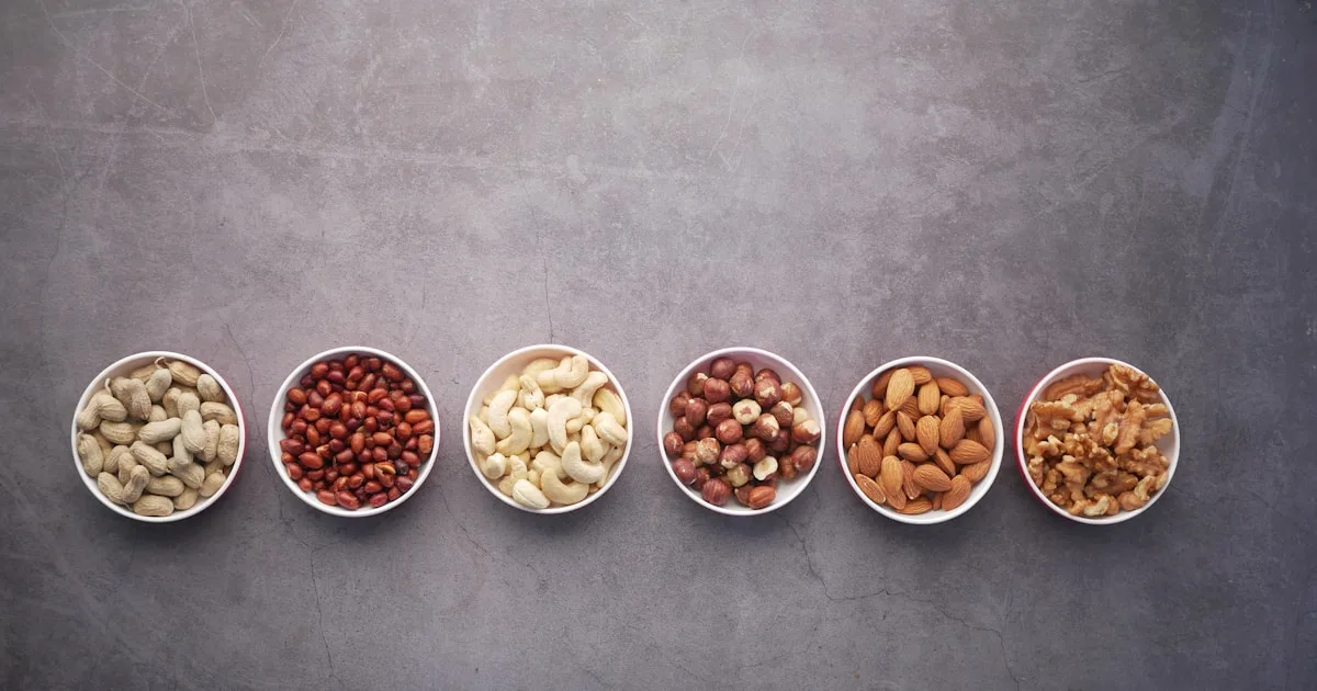 Bowls of nuts including walnuts, almonds and hazelnuts — plant-based omega-3 and healthy snack options for patients in Wellington, FL